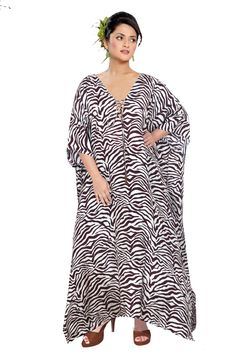 Elegantly decorated Zebra stripe print Maxi long Kaftan gown with lace up neck embroidered beads heading outline silk caftan tops Exclusive Persona you may carry with this kaftan dress hooking up the evergreen zebra print It outlines our worldly treasure of zebra breed with its striped outline all over the gown. Whether clubbing up with accessories or keeping it as it is you will stand out from the followings and grab the attention of people around you. Have it today itself... - One Size Fits Al Bohemian Striped Long Sleeve Kaftan, Striped Long Sleeve Bohemian Kaftan, Bohemian Striped Kaftan For Beach Cover-up, Striped Long Sleeve Kaftan For Vacation, Silk Kaftan Gowns, Kaftan Fashion, Women Silk Dress, Embroidered Beads, Silk Caftan