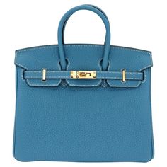 Brand: Hermès Style: Birkin Size: 25cm Color: Bleu Jean Material: Togo Leather Hardware: Gold Hardware (GHW) Dimensions: 10" W x 7.5" H x 4.75" D Handle Drop: 4" Designer Togo Leather Bag For Everyday Use, Designer Togo Leather Bag, Designer Togo Leather Travel Bag, Luxury Togo Leather Travel Bag, Elegant Togo Leather Textured Bag, Luxury Togo Leather Office Bag, Elegant Togo Leather Bags For Everyday Use, Everyday Togo Leather Bag, Luxury Togo Leather Top Handle Bag