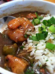 a white bowl filled with rice and vegetables