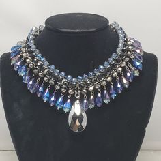 Ali Khan Glamour Collar Statement Necklace, A Striking Piece That Embodies Elegance And Sophistication. This Necklace Features Faceted Marquis Crystals In A Captivating Palette Of Black, Blue, And Gray, Creating A Stunning Visual Appeal. The Crystals Are Expertly Set On A Sleek 16-Inch Silver Chain, With An Extender To Ensure The Perfect Fit. Perfect For Any Occasion, This Statement Necklace Adds A Touch Of Glamour To Your Ensemble. It Comes Beautifully Packaged In A Gift Box, Making It An Ideal African Inspired Jewelry, Cultural Fashion, Blue Stone Necklace, Statement Collar Necklace, Ali Khan, Silver Jewelry Fashion, Box Making, Floral Necklace, Inspired Jewelry