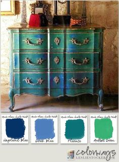 an old dresser painted in blue and green