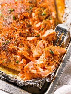 a close up of food on a pan with a fork