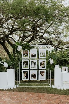 an outdoor wedding ceremony with pictures on the wall