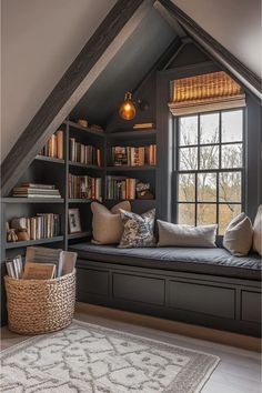 a window seat in the corner of a room with bookshelves and pillows on it