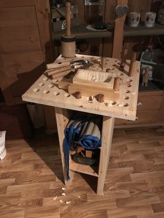 a wooden workbench with tools on it