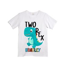 a white t - shirt with a cartoon dinosaur on it