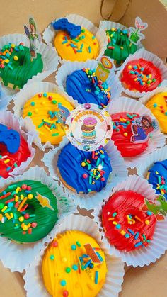 cupcakes decorated with colorful frosting and sprinkles