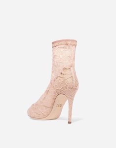 Experience luxury and sophistication with our Bette Corded Tulle Booties from Dolce & Gabbana. These boots feature a unique sock design, ensuring comfort style for your feet. Elevate fashion game make statement high-quality, designer booties.