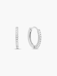 These super dainty hoop earrings hug your ear lobe for a subtle, barely-there look. SMALL:Outer diameter: 1cm (10 mm)Inner diameter: 0.7cm (7mm)*Fits some ear lobes, and is great for cartilage piercings and second piercings. MEDIUM (Pictured):Outer Diameter: 1.2 cm (12cm)Inner Diameter: 0.9cm (9cm)*For most ear lobes and lobes that are a bit thicker, ears that have a higher set piercing on the lobes or if you want to have a bit more space between the lobe and the hoop. Earrings are made of gold or rhodium plated brass, a sterling silver post and garnished white cubic zirconia stones. Please keep in mind what type of metals you are allergic/sensitive to. If you are not sure, please contact me and I will be more than happy to help you. Dainty White Round Huggie Earrings, Everyday White Gold Round Cartilage Earrings, Classic Adjustable White Gold Huggie Earrings, Silver Minimalist Round Cut Hoop Earrings, Classic White Gold Small Hoop Cartilage Earrings, Minimalist Sterling Silver Round Cut Hoop Earrings, Minimalist Hoop Earrings With Prong Setting For Everyday, Minimalist Everyday Hoop Earrings With Prong Setting, Classic Adjustable Round Cartilage Earrings