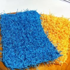 two different colored rugs sitting on top of each other