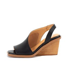 Meet VALDOSTA. This asymmetrical design is perfect for parties, the office, and any special or casual occasion. Stand comfortably in an ultra-padded, wrapped wedge with a modern square shape. Closure: slip-on Toe: square Heel Height: 3.5 inches Platform Height: 0.5 inches Materials: faux leather Insole: Yellow Box High Rebound EVA Outsole: rubber Swim Jewelry, Black Wedge Sandals, Modern Square, Asymmetrical Design, One Piece Swim, Black 7, Wedge Sandal, Winter Fashion Outfits, Square Shape