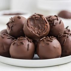 a plate full of chocolate truffles on a table