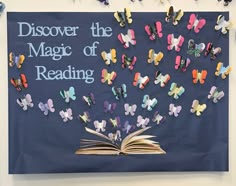 an open book with butterflies on it and the words, discovering the magic of reading