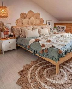 a large bed sitting inside of a bedroom on top of a wooden floor