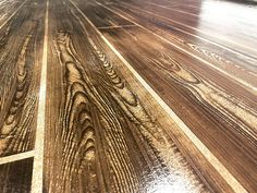 an image of wood flooring that looks like it has been polished and stained with gold