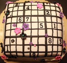 a cake decorated with flowers and numbers on it