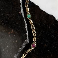 Vintage Cabochon Bracelet Features natural 5.5mm cabochon emerald, ruby and sapphire Solid 14k yellow gold Uniquely patterned chain Lobster clasp closure 6.2mm in width 7” in length, sizable Vintage *This bracelet can be resized, please confirm your final size before purchasing. If you would like this bracelet resized, please make a note of the size you need in the “Special Instructions” section of your cart. Adjustments are an additional 2-3 weeks and all sales are final on sized jewelry.* Luxury Unique Cabochon Bracelets, Luxury Vintage Bracelets With Clasp, Cabochon Bracelet, Ruby And Sapphire, How To Make Notes, 3 Weeks, Lobster Clasp, Ruby, Emerald