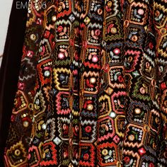 a close up of a colorful dress on display