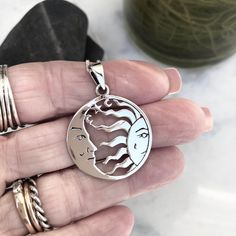 "Sun face and moon face pendant in sleek sterling silver Polished sun moon pendant is approx 1\" across, 1 1/2\" with bail. 925 sterling silver moon and sun medallion. You can choose a 1mm curb sterling silver chain in different lengths: 16\" 18\" 20\" Or you can purchase just the pendant, no chain. Your sun moon pendant necklace will come carded and bubble wrapped for safe travels. To see our whole shop: https://www.etsy.com/shop/Beadaboutique Any questions- just ask. Thanks for stopping by!" White Gold Sterling Silver Sun And Moon Jewelry, Silver Moon Jewelry With Sun And Moon Design, Sterling Silver Sun And Moon Jewelry, Sterling Silver Jewelry With Sun And Moon Design, Silver Jewelry With Sun And Moon Design, Silver Pendant Jewelry With Sun And Moon Design, Symbolic Silver Jewelry With Sun And Moon Design, Moon And Sun Face, Sun Medallion