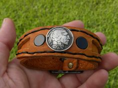 Adjustable Black Hand Tooled Bracelet, Artisan Adjustable Round Cuff Bracelet, Vintage Adjustable Leather Bracelet With Concho, Custom Adjustable Brown Bracelets, Adjustable Concho Cuff Bracelet Gift, Adjustable Brown Bracelets, Unique Adjustable Round Cuff Bracelet, Adjustable Black Bracelet For Collectible, Adjustable Black Bracelet For Collectors