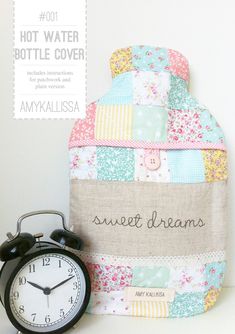 an alarm clock sitting next to a patchwork bag with the words sweet dreams written on it