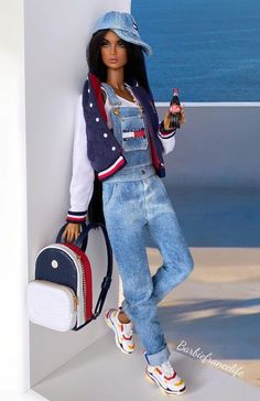 a barbie doll is leaning against a wall with a purse and bottle in her hand