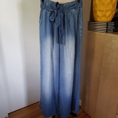 Beautiful & Flowy Lightweight Wide Leg Denim Pants With Belt! Brand: Zenana Color: Faded Blue Size: Large Cut: Wide Leg/Straight Leg Design/Details: Paperbag Style Waist With Elastic Lightweight Denim Pants. Wide Leg And 100% Lyocell. Side Pockets And Removable Belt. Condition: New Without Tags (Nwot) Waist: 14 Length: 43 All Pics Shown Are Of The Actual Item. Please Review Carefully For Additional Listed & Unlisted Details. Smoke Free Home Pet Free Home Bundle And Save On Shipping! Please Visit Mid-rise Washed Pants For Summer, Summer Mid-rise Washed Pants, Summer Washed Straight Leg Pants, Summer Straight Leg Washed Pants, Summer Wide Leg Washed Jeans, Wide Leg Washed Jeans For Summer, Summer Medium Wash Washed Pants, Denim Blue Cargo Jeans For Summer, Light Wash Mid-rise Summer Pants