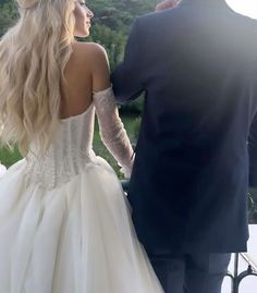 a bride and groom looking at each other