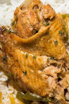 a close up of food on a plate with rice and meat in the middle,