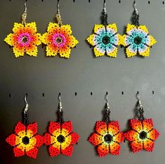 Traditional Mexican Handmade Huichol chaquira (beaded) earrings made by Mexican artisans in the Mexican state of Chipas. The earrings are lightweight, colorful and sure to bring you lots of compliments.  The length is approximately 2 inches and 1.5 inches wide with a post closure. Flower Beaded Earrings, Mexican Flowers, Traditional Mexican, Beaded Flowers, Beaded Earrings, Favorite Jewelry, Jewelry Earrings Dangle, Etsy Earrings, Dangle Drop Earrings