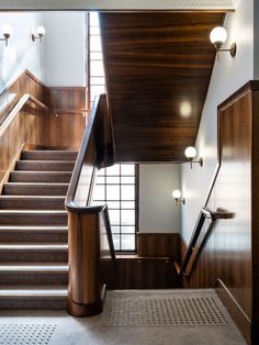 the stairs are made of wood and have metal handrails