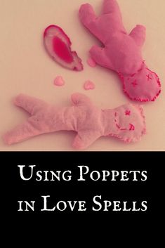 two pink stuffed animals sitting next to each other on top of a white surface with the words using poppets in love spells