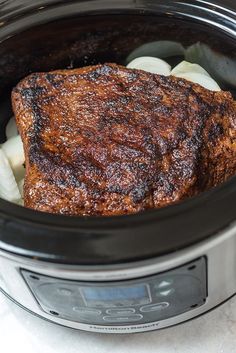 the meat is in the slow cooker ready to be cooked