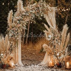 an outdoor wedding set up with candles and flowers