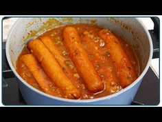 some carrots are cooking in a pot on the stove and it looks like they have been cooked