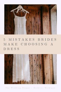 a white dress hanging on a wooden wall with the words 5 must make brides make choosing a dress