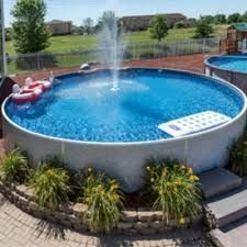 an above ground swimming pool with a water slide