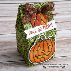 a trick or treat bag with pumpkins on it