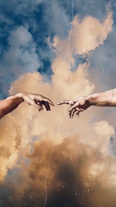 two hands reaching out towards each other in front of a sky with clouds and lightning