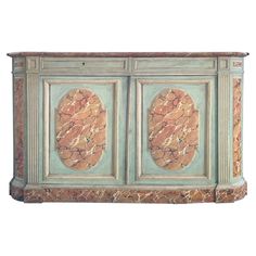 an old fashioned cabinet with two doors and marbled panels on the front, isolated against a white background