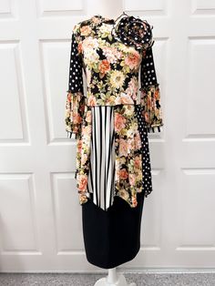 "This beautiful floral tunic top is made with double brushed stretchy material that is soft and very comfortable. The Matching skirt is sold separately.  XS Bust 34\" S   Bust 35\" M  Bust 37\" L   Bust 39\" XL Bust 42\" 2X Bust 45\" 3X Bust 48\" 4X Bust 51\"" Casual Flowy Floral Print Tunic, Casual Flowy Tunic With Floral Print, Fitted Floral Print Tunic, Fitted Long Sleeve Tops With Floral Patchwork, Stretch Floral Print Blouse For Brunch, Spring Floral Print Flowy Tunic, Fitted Long Sleeve Printed Tunic, Casual Long Sleeve Floral Print Tunic, Spring Floral Print Long Sleeve Tunic