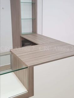 a wooden shelf with glass shelves in it