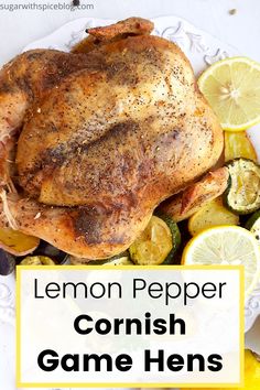 lemon pepper roasting chicken on a white plate with garnishes and vegetables