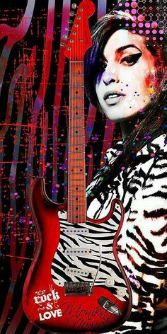 a woman holding a red electric guitar in front of a black and white striped background