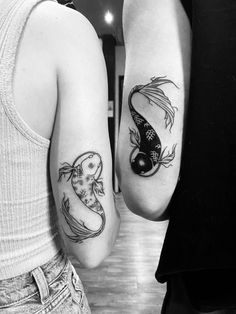 two people with matching tattoos on their arms