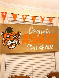 an orange and white banner with the words congrats ashley class of 2012