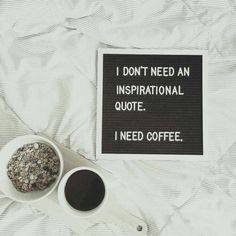 a sign that says i don't need an inspirational quote next to two cups of coffee