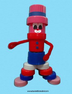 a red, white and blue plastic toy with a hat on it's head