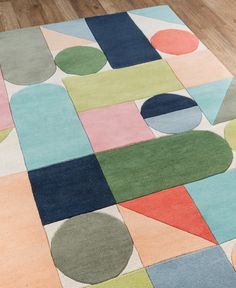 an area rug with various colored shapes on it