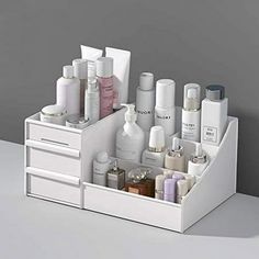 Product Description Overview: STONCEL makeup organizer is a perfect storage box for you bedroom and bathroom in hold brushes, creams, serums, tools, toners, lotions, hair spray, cotton ball and sperfume. As long as you see it, you will like it. I believe it is the cosmetic storage box you need. Advantages: Space Saver The makeup box is divided into 9 areas. Its a perfect skin care organizer for hold brushes, creams, serums, tools, toners, lotions, hair spray, cotton ball and sperfume. Also, it c Grey Makeup Organizer, Makeup Organiser Dresser, White Skincare Organizer, Bathroom Small Drawer Organization, Toner Storage, Skin Care Shelves, Makeup Storage Target, Makeup Desk Organization, Organizers For Makeup